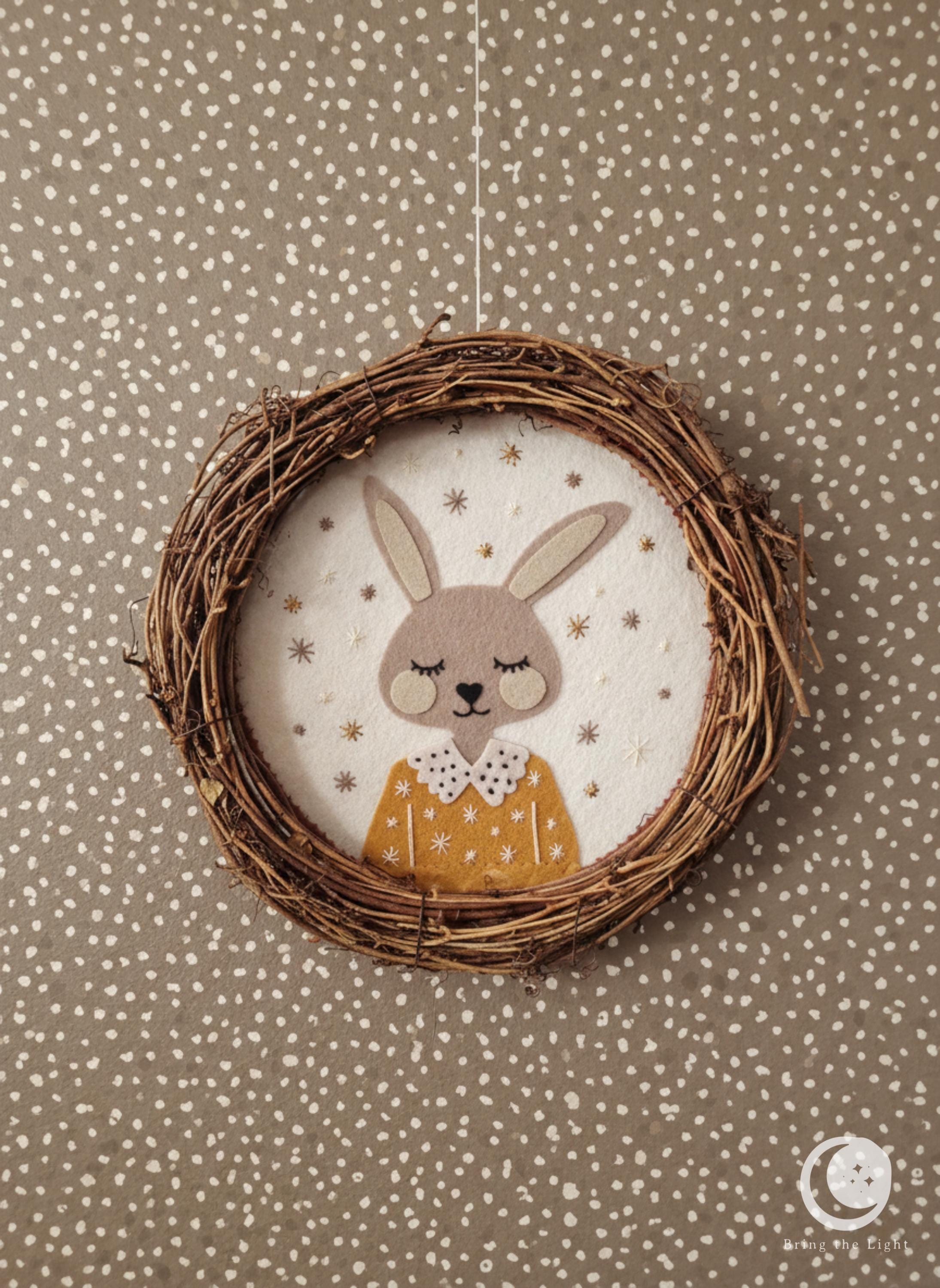 Handmade felt bunny wall wreath for a nursery