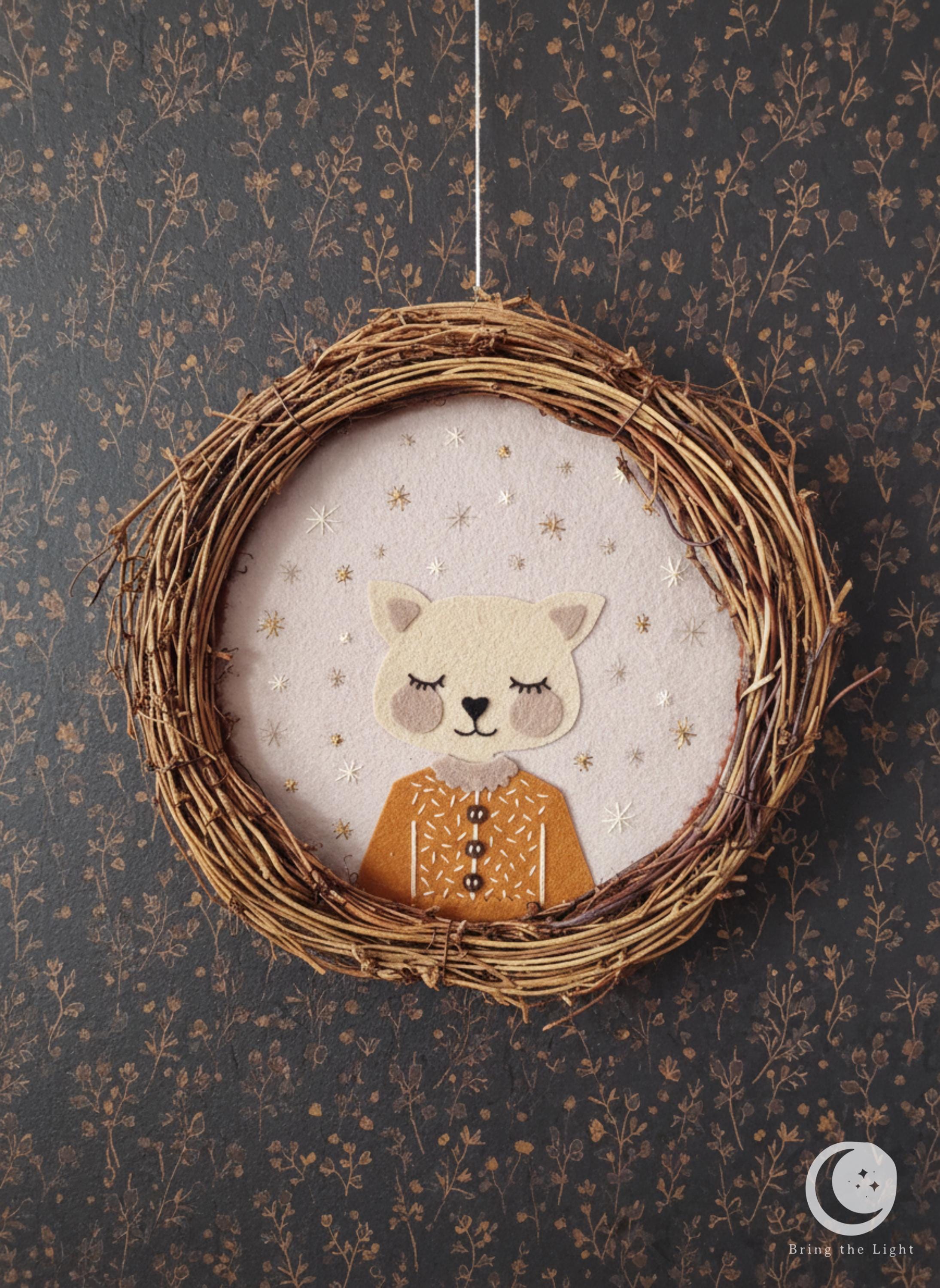 Handmade felt cat wall wreath in boho nursery tones
