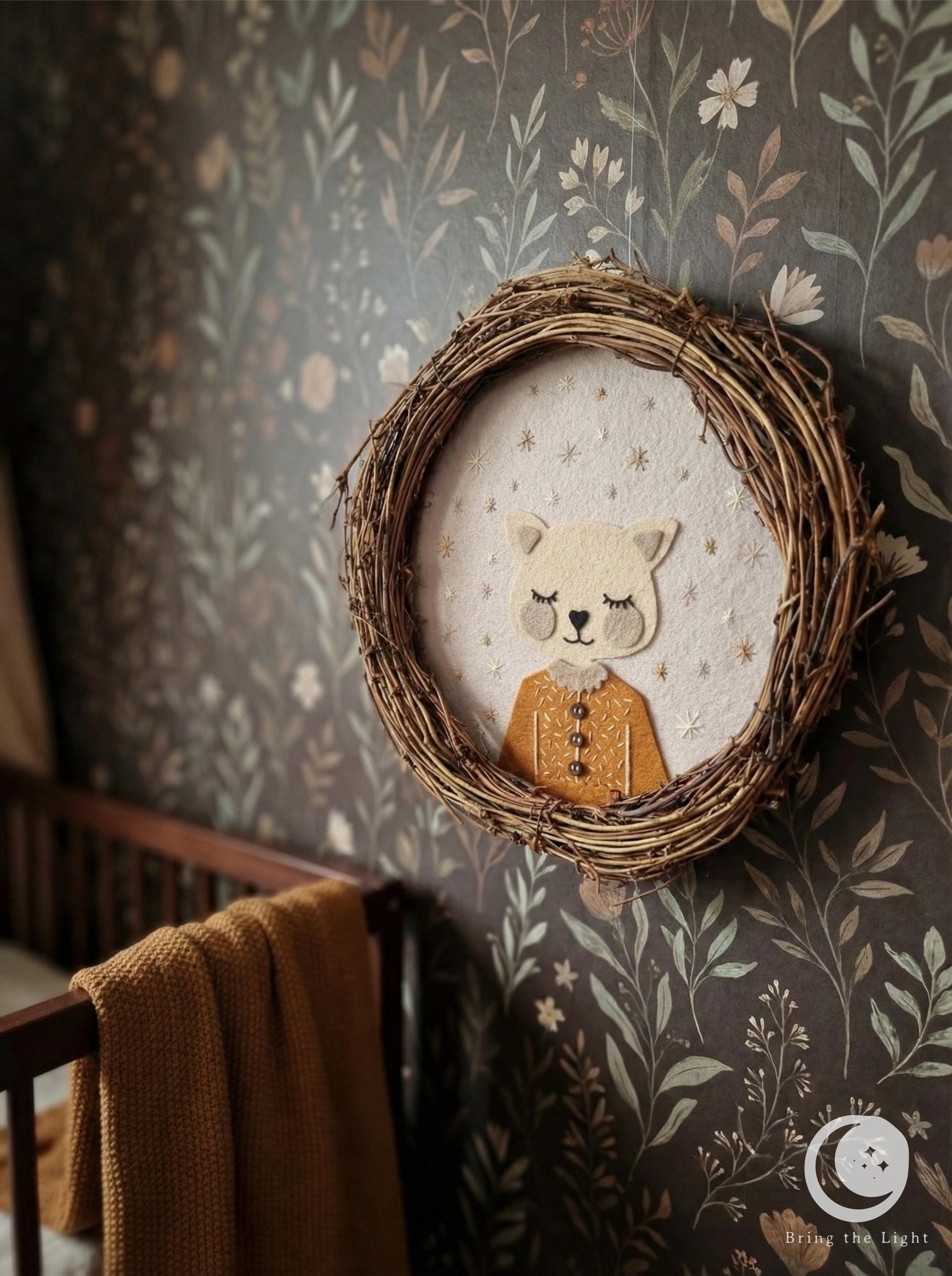 Handmade felt cat wall wreath in boho nursery tones