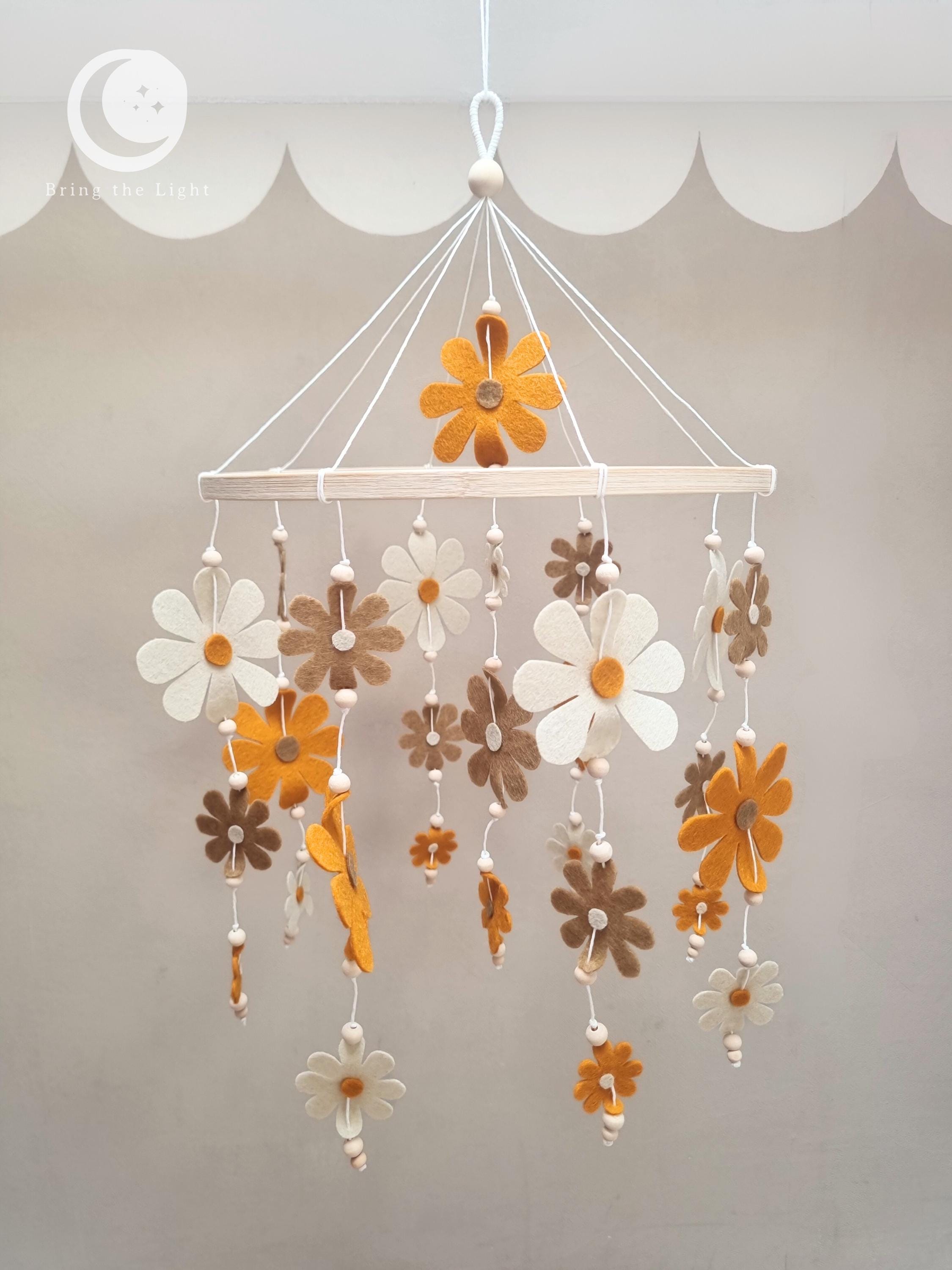 Felt flower baby mobile in neutral nursery tones