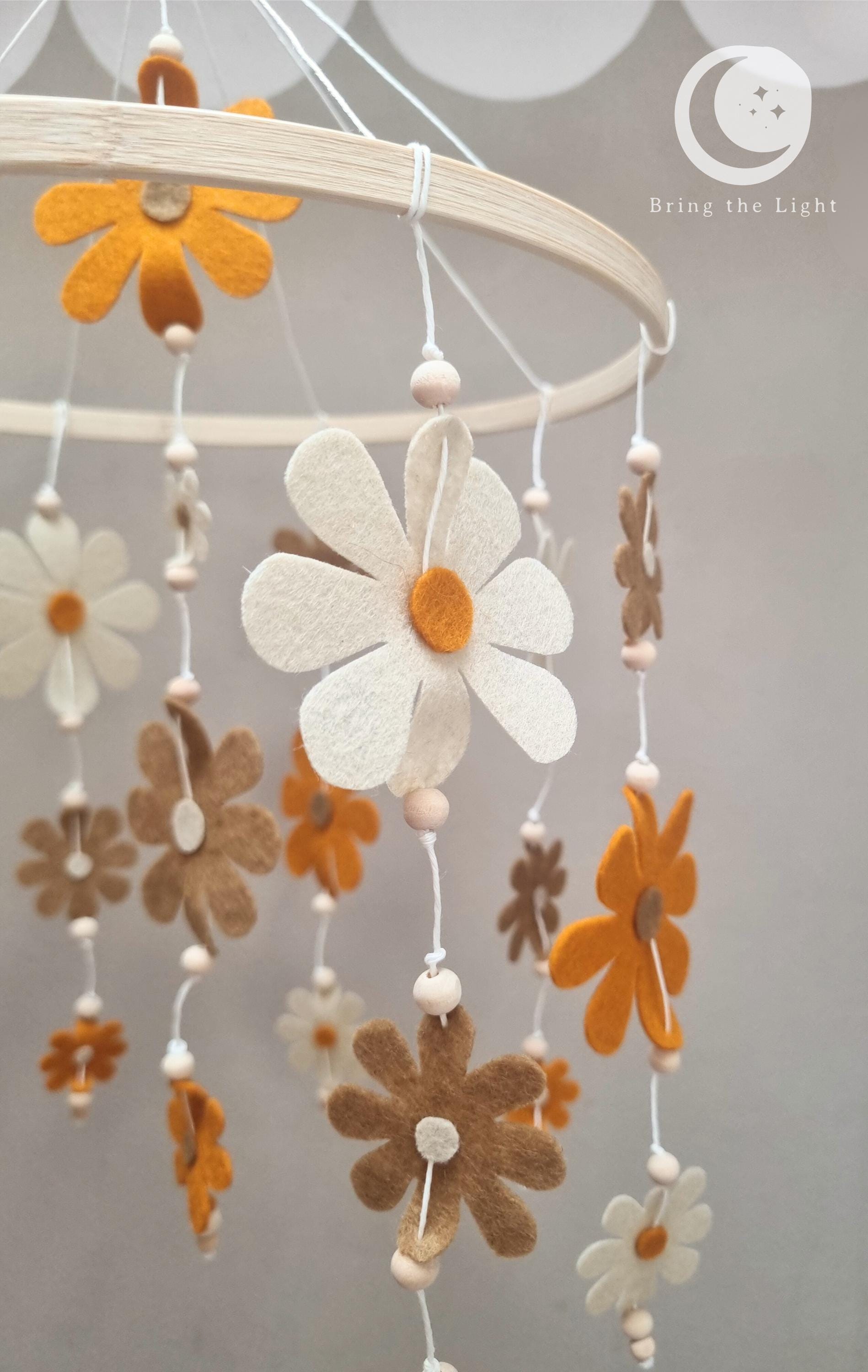 Felt flower baby mobile in neutral nursery tones