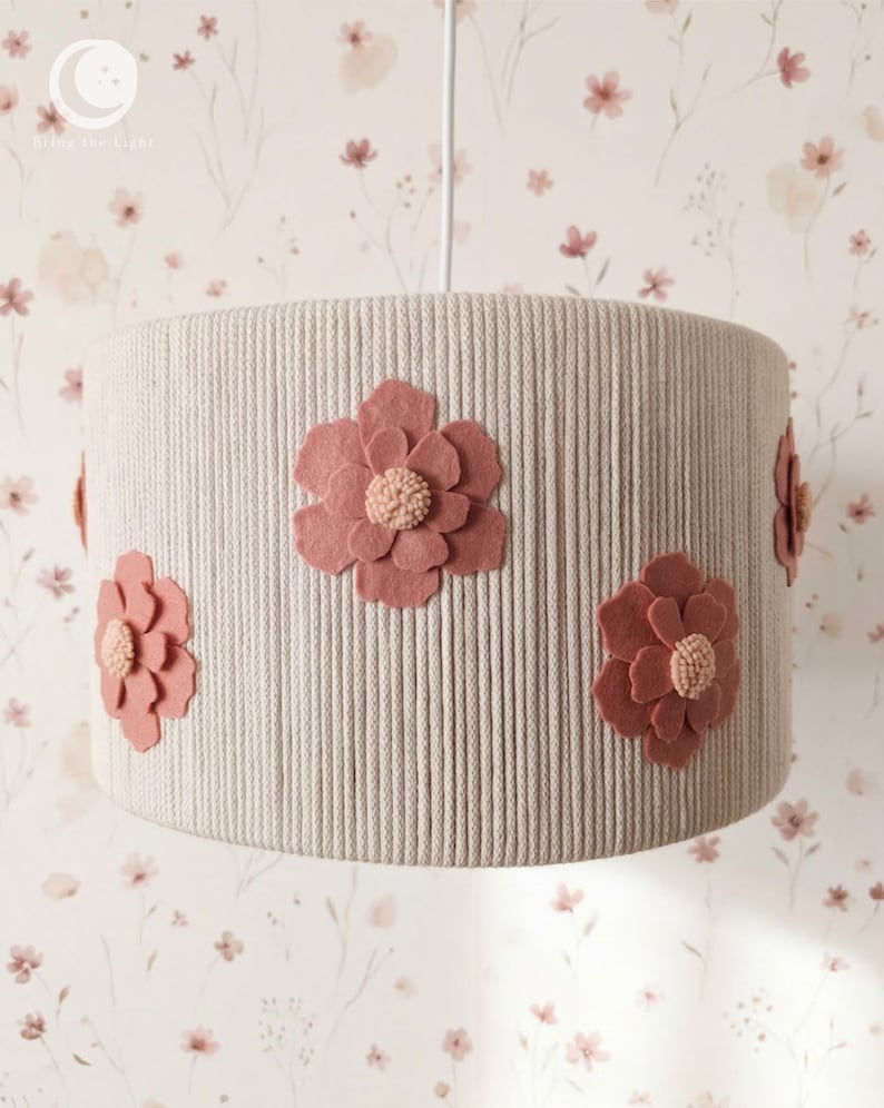 Handmade floral nursery lampshade with dusty-rose felt flowers on a beige cotton base